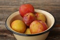 Juicy seasonal plums on the table macro