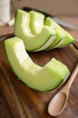 Juicy slice melon on a wooden table Royalty Free Stock Photo