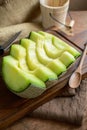 Juicy slice melon on a wooden table Royalty Free Stock Photo