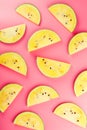 Juicy slices of yellow watermelon on a bright pink background. Conceptual colors of summer. Patterns top view as a background or Royalty Free Stock Photo