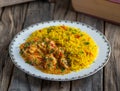 Juicy spicy prawns rice served in a dish isolated on wooden background side view of rice Royalty Free Stock Photo