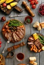 Juicy steak cooked on a grill with grilled vegetables Royalty Free Stock Photo