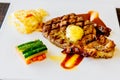 Juicy steak medium rare beef with mashed potato and vegetable with sauce. Top view, close up Royalty Free Stock Photo