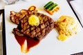 Juicy steak medium rare beef with mashed potato and vegetable with sauce. Top view, close up Royalty Free Stock Photo