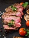 Juicy steak medium rare beef with spices Royalty Free Stock Photo