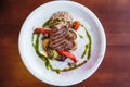 Juicy steak with vegetables , cooked on the grill. Royalty Free Stock Photo