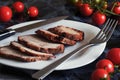 Juicy steak well done roast pork with red sauce and Basil leaves on a white plate over a black marble table Royalty Free Stock Photo