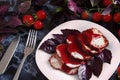 Juicy steak well done roast pork with red sauce and Basil leaves on a white plate over a black marble table Royalty Free Stock Photo