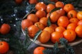 juicy tangerines on the table, delicious background, festive table for Christmas, fir branches, vitamins for health