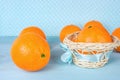 Juicy tangerines in wicker basket,