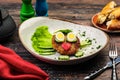 Juicy tasty meat fried cutlets with hot mashed potatoes, green lettuce leaves, on a white plate with cutlery Royalty Free Stock Photo