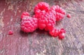 Juicy tasty raspberries. Red berries on an old shabby bench. Healthly food