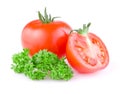 Juicy tomato cut in half and a sprig of parsley Royalty Free Stock Photo