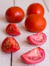 Juicy tomato quarters on a white plate Royalty Free Stock Photo