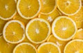 Juicy vibrant yellow orange slices closeup backing Royalty Free Stock Photo