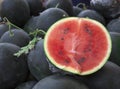 Juicy watermelons. Watermelons at the farmers market of Tunisia.A large slice of ripe juicy watermelon at the village market.