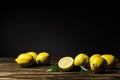 juicy yellow lemons on wooden table