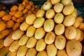 Juicy yellow mango pile on rustic market stall. Asian fruit market stall. Philippine mango season. Fresh fruit for sell. South