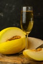 juicy yellow melon with a glass of champagne Royalty Free Stock Photo