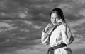 jujitsu girl in kimono on sky background