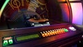 Jukebox automatically rearranging discs for playing music with coin is inserted Royalty Free Stock Photo