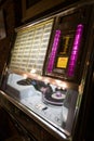 Jukebox with songs on vinyls. a front with available songs and the selection buttons