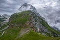 Julian Alps mountain Mangart from Mangrt saddle, Slovenia\'s Highest Panoramic Road, foggy weather