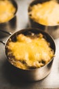 Julienne with chicken, cheese and mushrooms served in small metal bowl