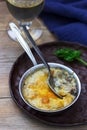 Julienne with mushrooms and bechamel sauce with cheese, served with white wine. Rustic style