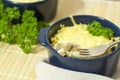 Julienne with mushrooms and cream. Mushroom and cheese gratin in ceramic bowls, on wooden background Royalty Free Stock Photo
