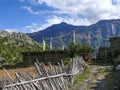 Julu village and Annapurna 2 in the clouds, Nepal Royalty Free Stock Photo