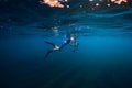 July 30, 2019. Anapa, Russia. Underwater photographer with camera swim in sea