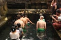 14 July 2018: Bali Indonesia:Indonesian and tourism pray and bath themselves in the sacred waters of the fountains, in Tirta Empul