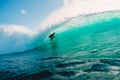 July 29, 2018. Bali, Indonesia. Surfer ride on barrel wave. Professional surfing in ocean at big waves