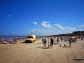 July 28, 2019. Beach in Vecaki, Latvia. Hot sunny summer Day +32C. Ambulance on the beach