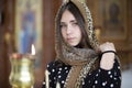 Portrait of a faithful girl in church.