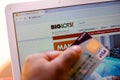 July 5, 20020, Brazil. The Big Lots website is shown on a laptop in the background and a person holds a bank card