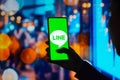 July 27, 2022, Brazil. In this photo illustration, the Line Corporation logo is displayed on a smartphone screen