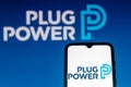 July 18, 2021, Brazil. In this photo illustration the Plug Power logo is seen on a smartphone and a pc screen