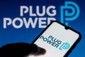 July 18, 2021, Brazil. In this photo illustration the Plug Power logo is seen on a smartphone and a pc screen