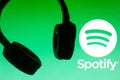 July 6, 2021, Brazil. In this photo illustration the Spotify logo is displayed along with the headset. Is a music, podcast and