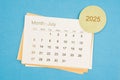 July 2025 calendar page on blue background Royalty Free Stock Photo