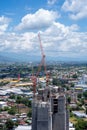 11 July 2023, Chiang Mai, Thailand : Construction cranes at building site in Chiang Mai downtown. Two of tower Construction site