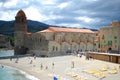 17 JULY 2009, COLLIOURE, FRANCE - tourists enjoy visiting The Notre Dame Church overlooking the harbor of Collioure