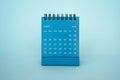 July 2022 desk calendar blue color on top of desk