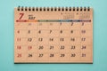 July 2021 desk calendar on green background