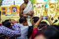 July 2018,Durgapur, West Bengal, India. A Purohit Panda Blessing a devotee with holy flowers at Rath Yatra Festival during Night.