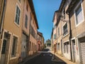 July 18, 2017 France city of Cluny, region of the Burgundy: Old narrow street of the central part of the city in hot, sunny summer