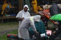 11 JULY 2013 - GARANA, ROMANIA. Scenes and people sitting or walking on the street in a rainy day Royalty Free Stock Photo