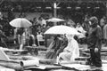 11 JULY 2013 - GARANA, ROMANIA. Scenes and people sitting or walking on the street in a rainy day Royalty Free Stock Photo